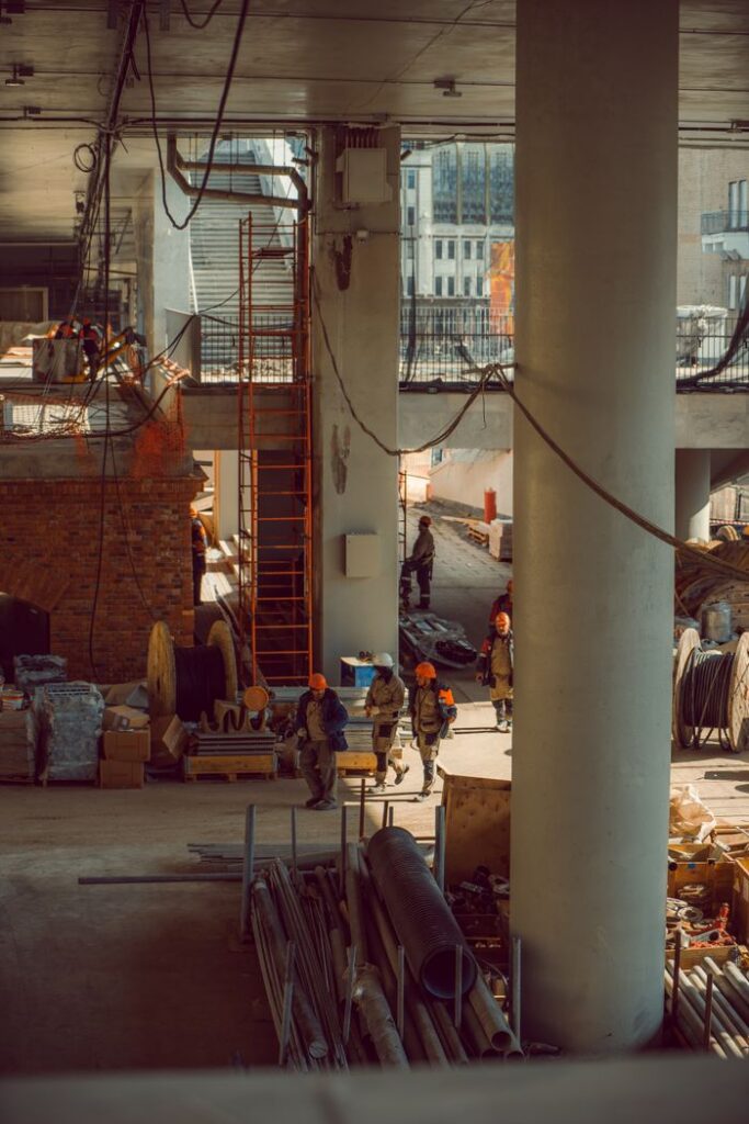A busy urban construction site with workers and extensive equipment, highlighting modern construction techniques.